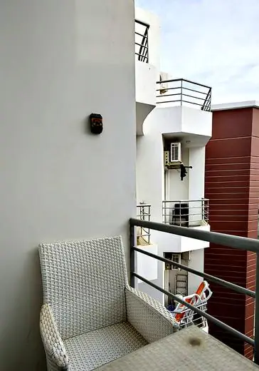 Wicker chair on the living-room balcony