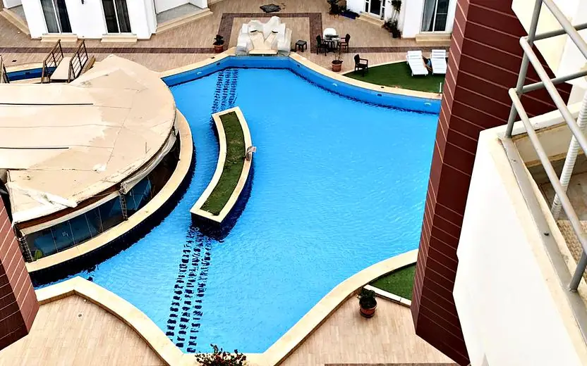 Pool seen from the kitchen balcony
