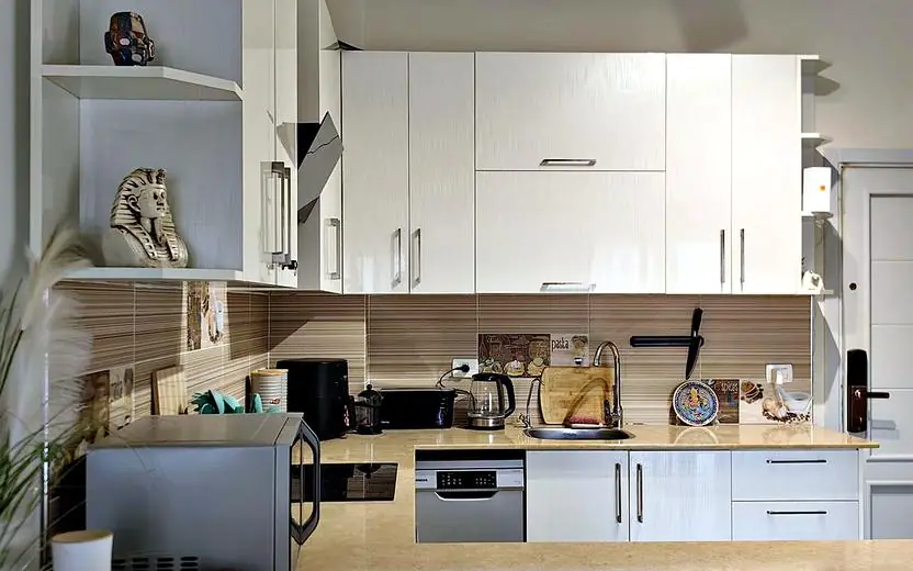 Kitchen with white gloss cabinets