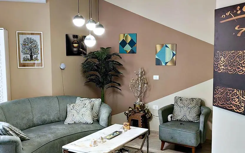 Living room with plants and pendant lights